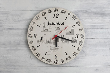 Clock on a wooden background. Special cut