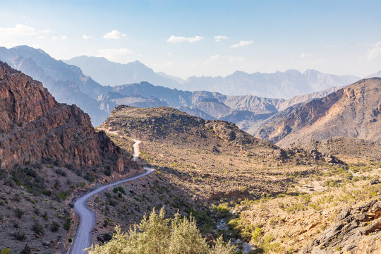 A road passing through the desert mountains of Oman.