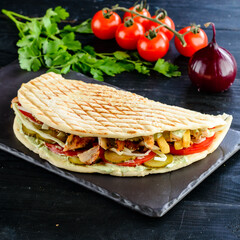 Kebab in a bun on woodboard, Shawarma sandwich gyro fresh pita bread chicken