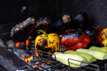 Grilled fresh vegetables. Yellow, red bell peppers and eggplant are grilled. Vegetarian BBQ