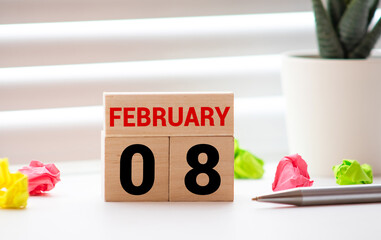 Wooden cubes calendar with the date of February 08.
