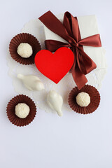 valentine's day background. candies and sweets. gift box, red heart and chocolates