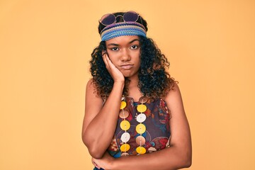 Young african american woman wearing bohemian and hippie style thinking looking tired and bored with depression problems with crossed arms.