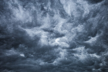 Dark cloudy sky before thunderstorm background. Storm Wide gloomy backdrop. Cloudscape dark thunderstorm clouds.