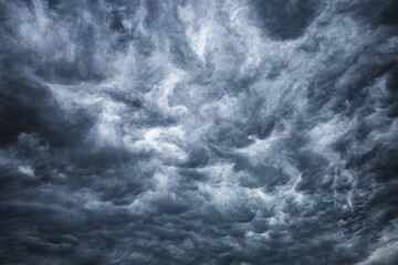 Dark cloudy sky before thunderstorm background. Storm Wide gloomy backdrop. Cloudscape dark thunderstorm clouds.