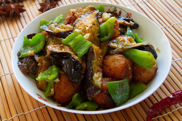 Stir-fried Eggplant, Potatoes & Peppers close up. Chinese food. Di san xian.