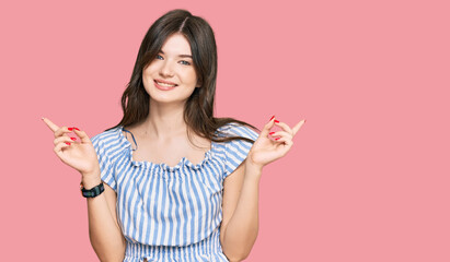 Young beautiful caucasian girl wearing casual clothes smiling confident pointing with fingers to different directions. copy space for advertisement