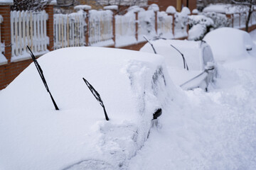 Parked cars covered of snow in Madrid