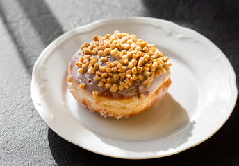 sweet donut on a white plate