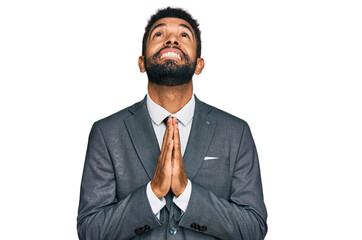 Young african american man wearing business clothes begging and praying with hands together with hope expression on face very emotional and worried. begging.