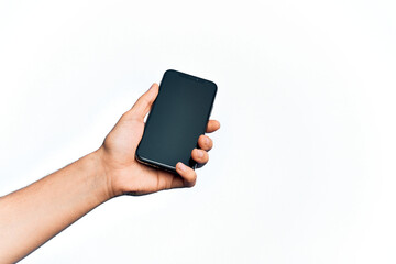 Hand of caucasian young man holding smartphone showing screen over isolated white background