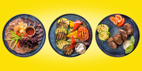 Three courses: with sliced meat, grilled vegetables and barbecue meat on a yellow isolated background. The concept of restaurant service. Business lunch.