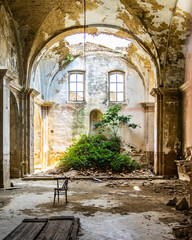 Interior of an abandoned church in Craco, a ghost town in Basilicata region abandoned due to a landslide, Italy