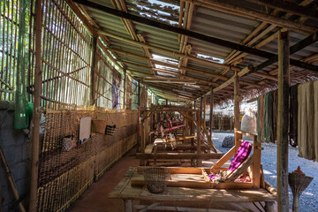 Hand weaving of cotton cloth by hill tribes of northern Thailand.