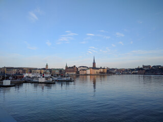 Klara Malarstrand quay and Riddarholmen at sunset light, Stockholm, Sweden.