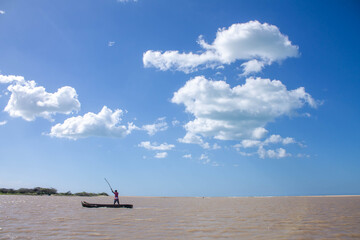 person in canoe on sea