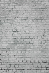 grunge background: faded brick wall with whitewash and remnants of green paint