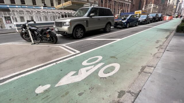 bicyclist biking on bike lane with bicycle in Manhattan NYC