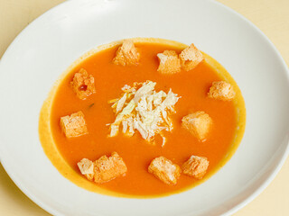 home made Pumpkin Soup Tasty orange pumpkin soup with horseradish and fresh multigrain baguette