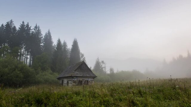 4K Timelapse of Dawn Under the Kralova Hola, Chamkova Stodola, Misty Morning and Old Wooden Hut in the Mountains