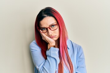 Young caucasian woman wearing casual clothes and glasses thinking looking tired and bored with depression problems with crossed arms.