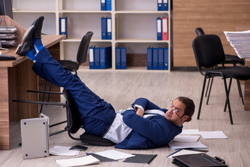 Young male businessman employee unhappy with his work