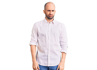 Fototapeta premium Young handsome man wearing elegant shirt depressed and worry for distress, crying angry and afraid. sad expression.