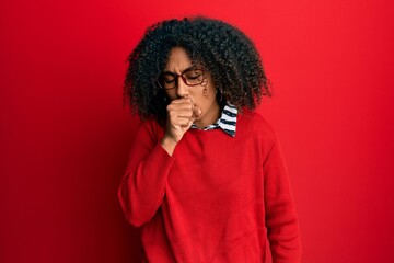 Fototapeta na wymiar Beautiful african american woman with afro hair wearing sweater and glasses feeling unwell and coughing as symptom for cold or bronchitis. health care concept.