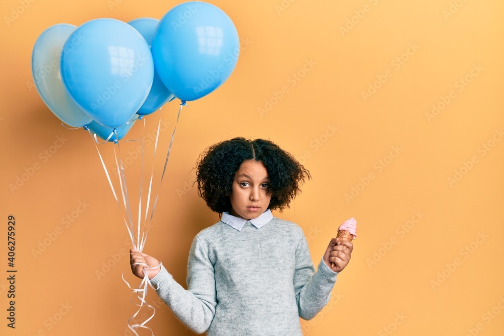 Poster Young little girl with afro hair holding ice cream and blue balloons in shock face, looking skeptical and sarcastic, surprised with open mouth