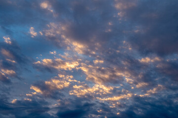 Sunset Reflecting in Big Sky Clouds