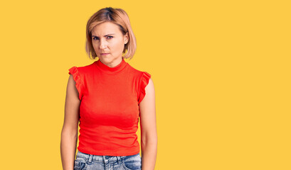 Obraz premium Young blonde woman wearing casual clothes skeptic and nervous, frowning upset because of problem. negative person.