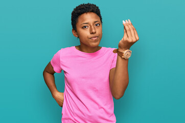 Young african american woman wearing casual clothes doing italian gesture with hand and fingers confident expression
