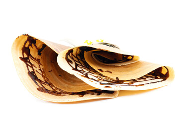 Crepe with and chocolate on a white background