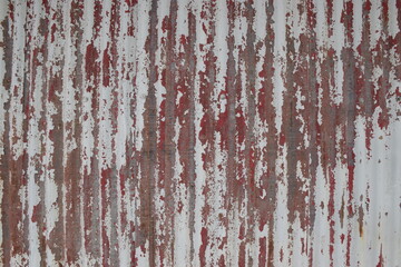 Rough paint effects on a corrugated iron surface