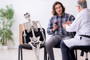 Young male patient visiting experienced doctor psychiatrist