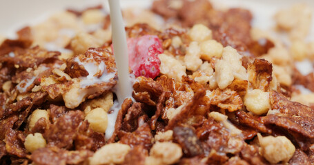 Pour milk into the cereal