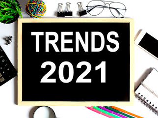 TRENDS 2021 Concept on drawing board with office tools