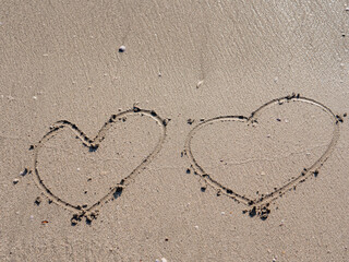 heart symbol written on sand as a background. Valentines day concept.