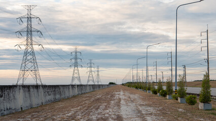 Electric poles are located at the sea in the Thai industrial area.
