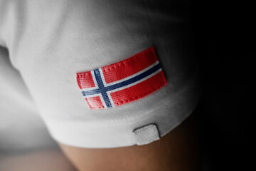 Patch of the national flag of the Norway on a white t-shirt