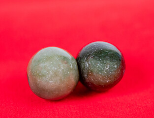 Multi colored jade with red background.