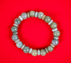 Multi colored jade with red background.