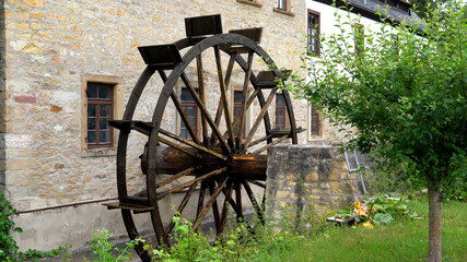 Mill wheel in motion, old watermill of Bad Sobernheim, Germany - obrazy, fototapety, plakaty