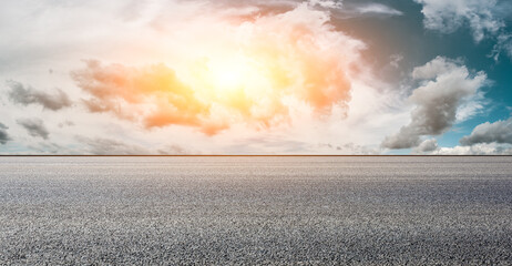 Asphalt road and sky clouds at sunset.Road background.