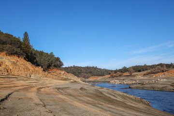 Beautiful Red Rock and Shoreline of the North Fork of the American River at Low Water Below the Folsom Reservoir High Water Line