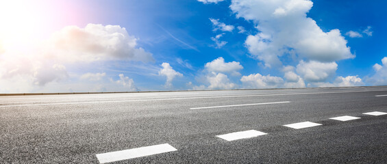 Empty asphalt road and blue sky with white clouds.Road background.