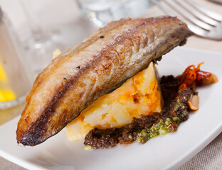 Mackerel fillet with mashed potatoes and spices. High quality photo