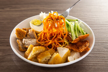 Mee Rojak is Malaysia Indian food of noodle with peanut sauce.