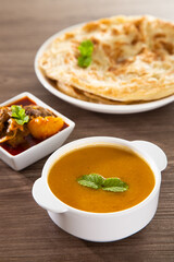 Roti Parata or Roti canai with lamb curry sauce.