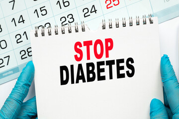 The doctor points to the text STOP DIABETES , medical concept